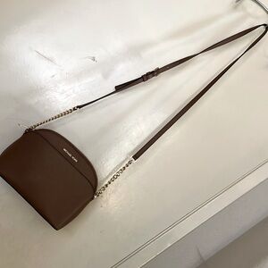 Micheal Kors crossbody with gold chain accents.